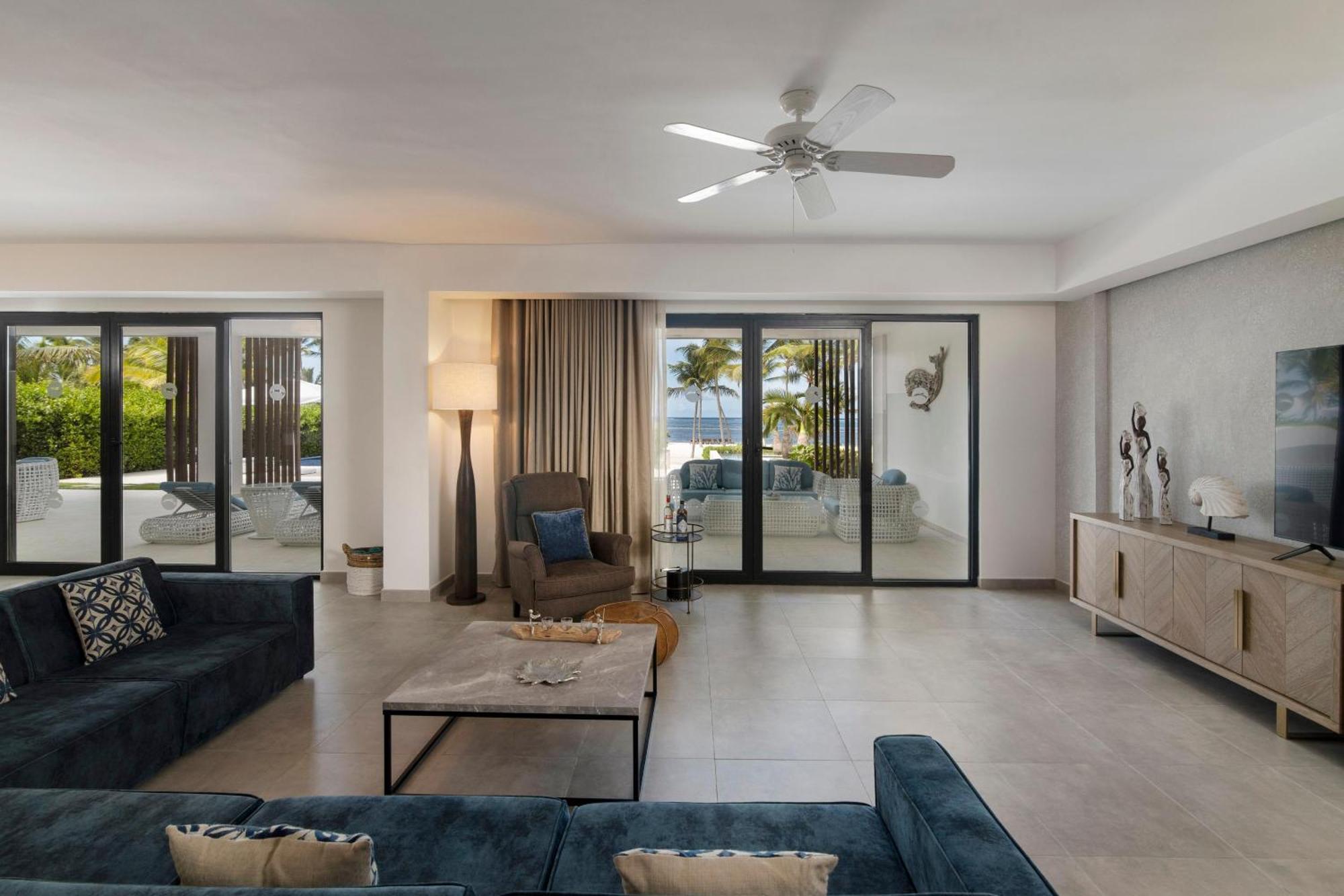 Serenade Punta Cana Beach & Spa Resort Exterior photo A living room with a ceiling fan